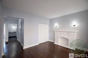 Chicago apartment for rent - A living room with a fireplace and wood floors.