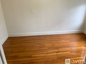 Boston apartment for rent - A room with wooden flooring and white walls.