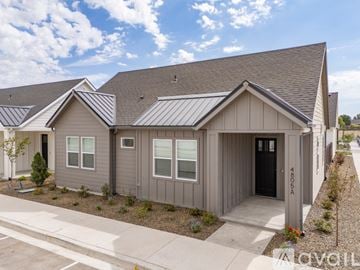 Caldwell house for rent - A modern kitchen with a stainless steel refrigerator and white countertops.