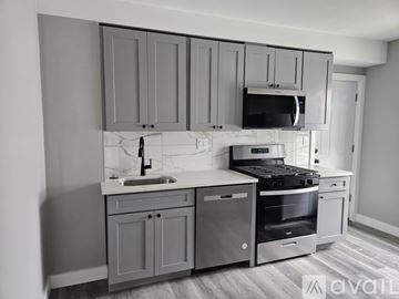 Everett apartment for rent - A kitchen with grey cabinets and stainless steel appliances.