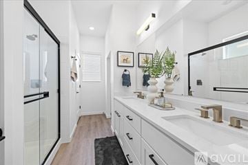 Caldwell house for rent - A kitchen with white cabinets and appliances.