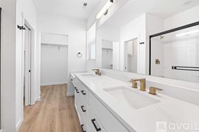 Caldwell house for rent - A bathroom with a white sink and a mirror.