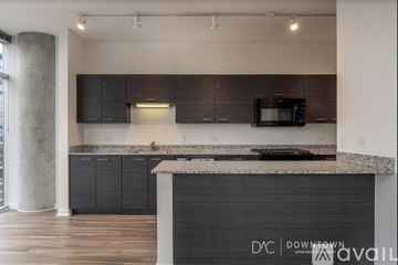 Chicago apartment for rent - A kitchen with a counter top and a microwave.