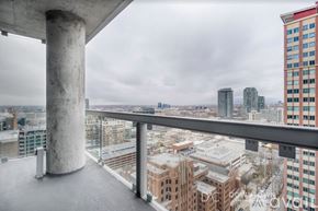 Chicago apartment for rent - A view from a high-rise building looking out over a cityscape.