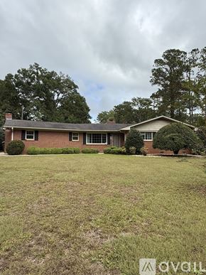 Moultrie house for rent - A house with a lawn in front of it.