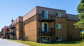 Dartmouth apartment for rent - A red brick building with a balcony on the second floor.