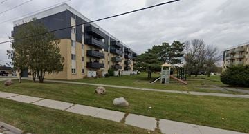 Amherstview apartment for rent - A grassy area in front of apartment buildings.
