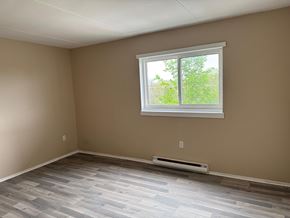 Amherstview apartment for rent - A room with a window and a heater on the floor.