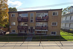 Belleville apartment for rent - Apartment building with a black car parked in front.