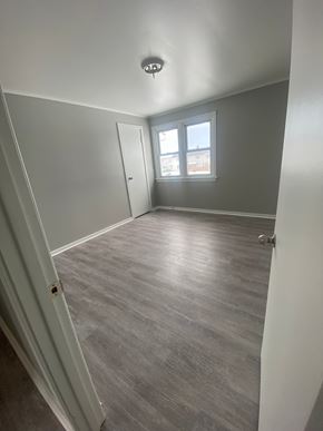 Picton apartment for rent - A room with a grey floor and a window letting in light.