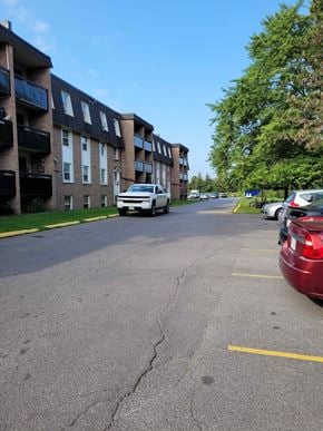 Belleville apartment for rent - A white car is parked on the side of a street.