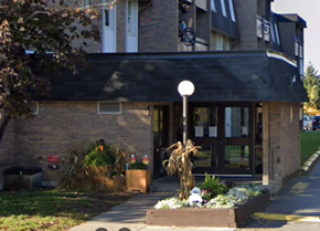 Belleville apartment for rent - A building with a black awning and glass doors.