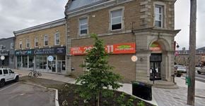 Smiths Falls apartment for rent - A building with a sign that says "Pizza Pizza" on it.
