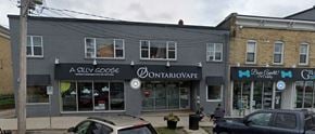 Smiths Falls apartment for rent - A street view of a building with a sign that says "A Sully Goose".