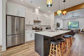 Twin Falls house for rent - A modern kitchen with a large island and stools.