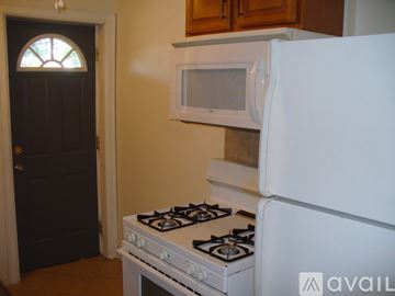 Columbus apartment for rent - A white stove and refrigerator in a kitchen.