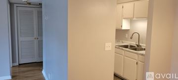 Nashville condo for rent - A kitchen with white cabinets and a sink.