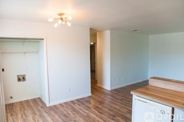 Austin apartment for rent - A kitchen area with a wooden counter top and a dishwasher.