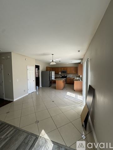 Hiram house for rent - A spacious living room with a kitchen in the background.
