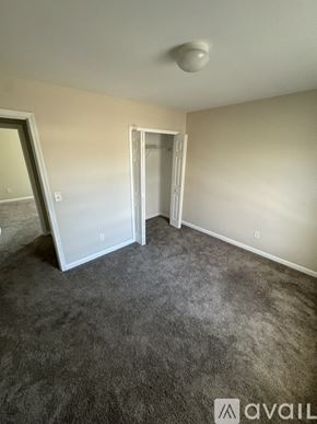 Hiram house for rent - A room with a grey carpet and a white ceiling light.