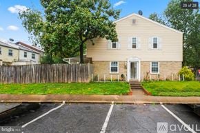 Manassas apartment for rent - A two-story house with a white front door and a porch.