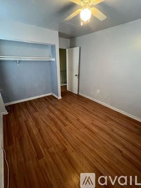 Manassas apartment for rent - A room with wooden flooring and a ceiling fan.