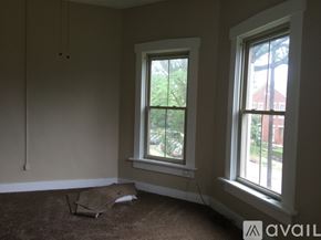 Dayton townhouse for rent - A room with two windows and a carpet on the floor.