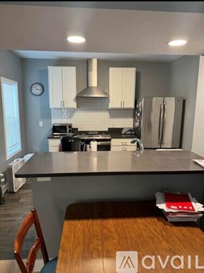 Madison apartment for rent - A kitchen with a stove, oven, and refrigerator.