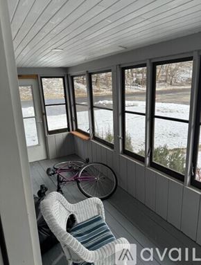 Madison apartment for rent - A room with a bicycle and a chair inside.