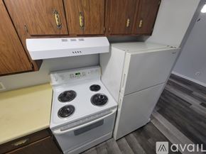Sparta apartment for rent - A room with wooden flooring and a window overlooking a fence.