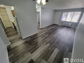 Sparta apartment for rent - A spacious room with wood flooring and a ceiling fan.