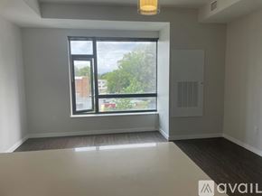 Denver apartment for rent - A room with a large window and a view of the outdoors.