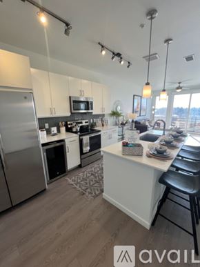 Denver apartment for rent - A modern kitchen with a large island and stainless steel appliances.