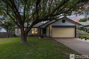 Round Rock house for rent - A house with a tree in front of it.