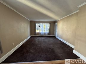 Scranton apartment for rent - A room with a carpeted floor and a window letting in natural light.