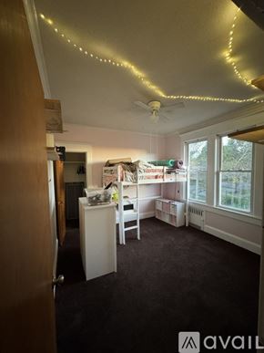Scranton apartment for rent - A room with a bed, desk, and chair.