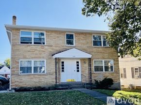 Deer Park apartment for rent - A two-story brick house with a white door and windows.