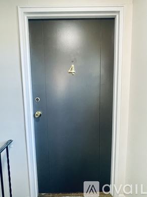 Deer Park apartment for rent - A black door with a gold number 2 on it.