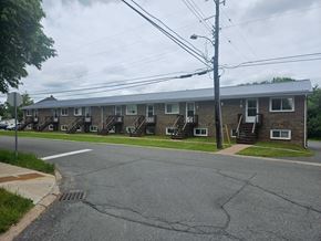 Stellarton apartment for rent - A row of houses with a grey sky above.