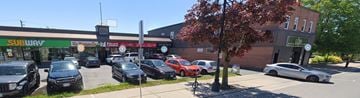Prescott apartment for rent - A parking lot with cars and a Subway restaurant in the background.