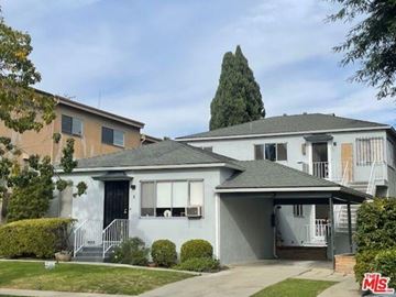 Santa Monica apartment for rent - A house with a grey roof and a white fence in front.