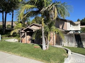 San Diego condo for rent - A kitchen with a fan and a marble floor.