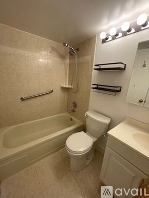 Boca Raton apartment for rent - A bathroom with a toilet, sink, and bathtub.
