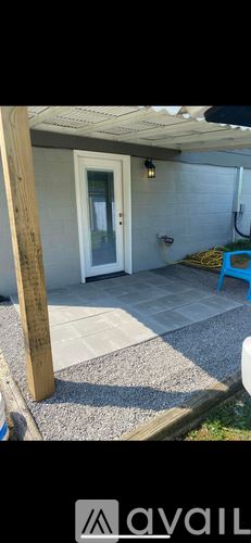 Rose Hill townhouse for rent - A patio area with a door and a table.