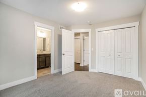 Hudsonville townhouse for rent - A room with white doors and a carpeted floor.
