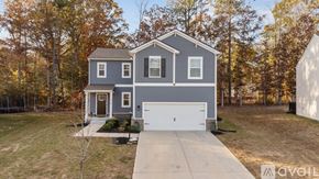 New Kent house for rent - A two-story house with a garage is available for sale.