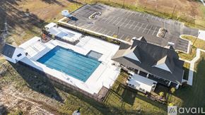 New Kent house for rent - A large house with a pool and a parking lot.