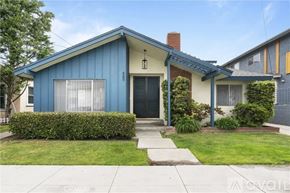 Long Beach apartment for rent - A blue house with a black door and a small porch.