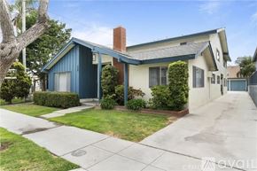 Long Beach apartment for rent - A house with a blue roof and a white wall is for sale.