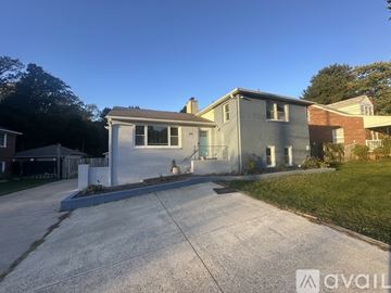 Silver Spring apartment for rent - A kitchen with a refrigerator and a door with a window.